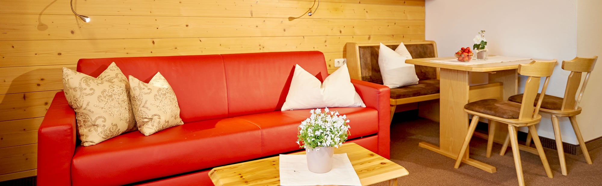 Comfortable seating area in an apartment of the Apartmenthotel Panorama, Wagrain